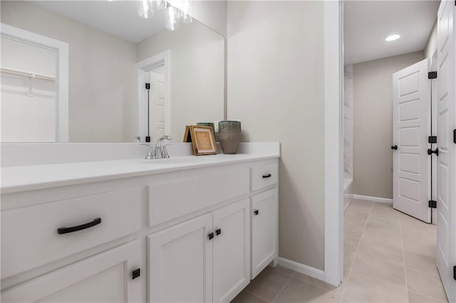 16388 S Brougham Dr, Olathe, KS 66062 - full bath featuring vanity, baseboards, recessed lighting, and tile patterned flooring