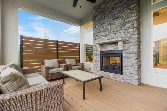 16388 S Brougham Dr, Olathe, KS 66062 - wooden deck featuring a ceiling fan and an outdoor stone fireplace