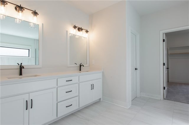 bathroom with oversized vanity, tile floors, and dual sinks