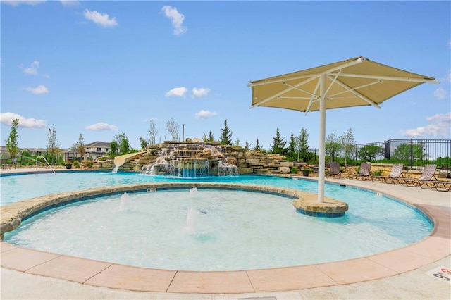 view of swimming pool featuring pool water feature