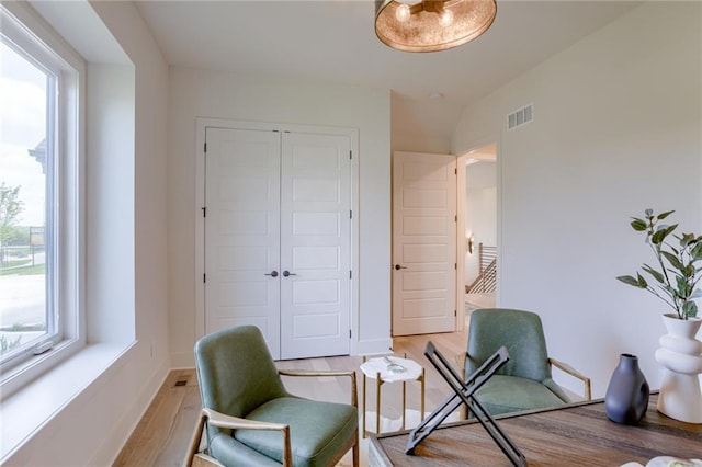 home office with light hardwood / wood-style flooring