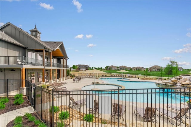 view of swimming pool featuring a patio area