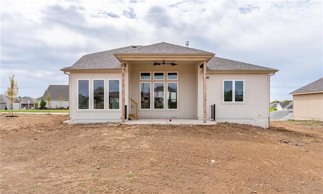 back of property featuring ceiling fan