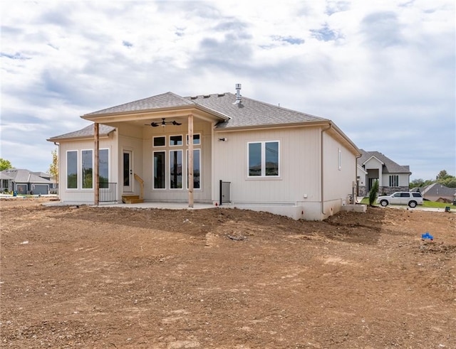 rear view of property with ceiling fan