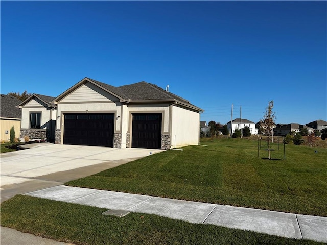 view of front facade with a front lawn and a garage