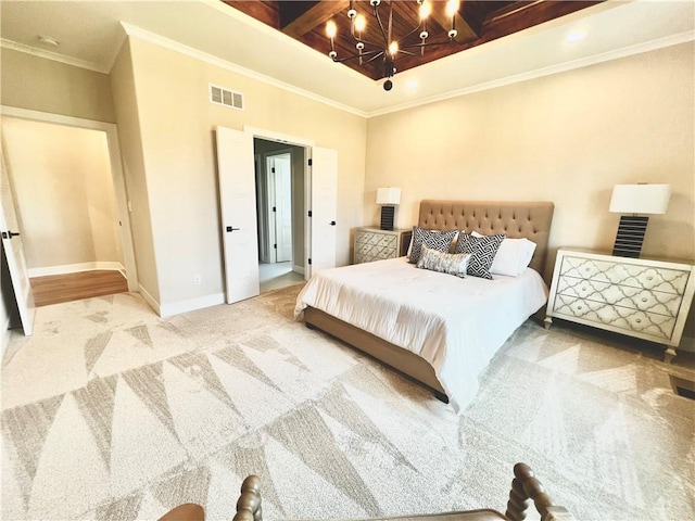 carpeted bedroom with crown molding and beam ceiling