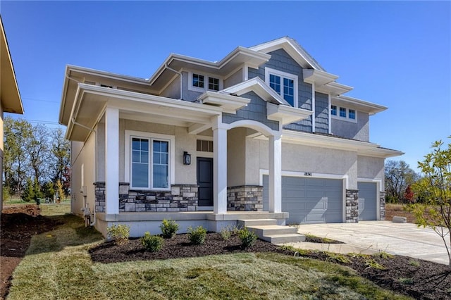 view of front of house featuring a garage and a front lawn