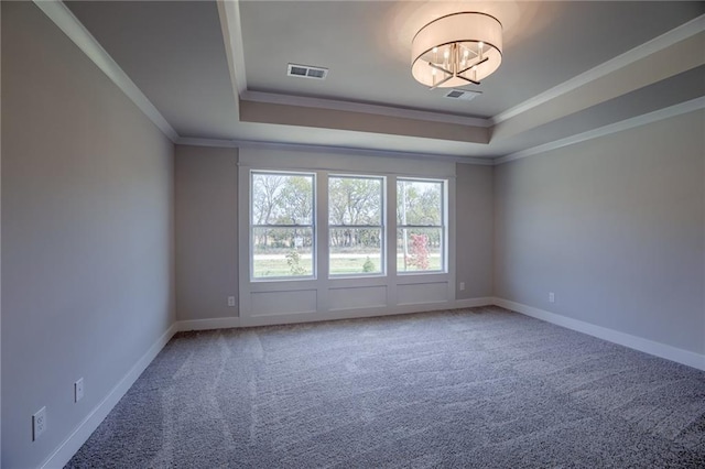 unfurnished room featuring carpet, a chandelier, crown molding, and a tray ceiling