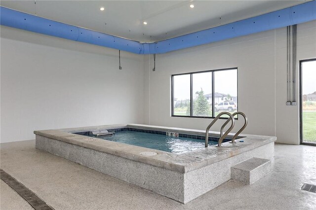 view of swimming pool featuring an indoor in ground hot tub