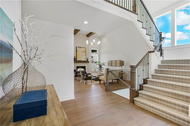 25212 W 92nd St, Lenexa, KS 66227 - foyer entrance featuring a chandelier, stairway, wood finished floors, and recessed lighting