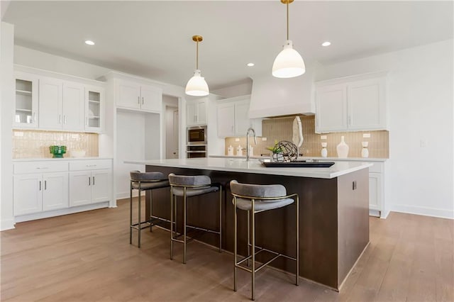 25212 W 92nd St, Lenexa, KS 66227 - kitchen with white cabinetry, backsplash, appliances with stainless steel finishes, and light countertops