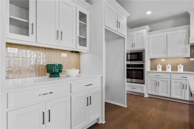 25212 W 92nd St, Lenexa, KS 66227 - kitchen with built in microwave, glass insert cabinets, oven, white cabinetry, and light countertops