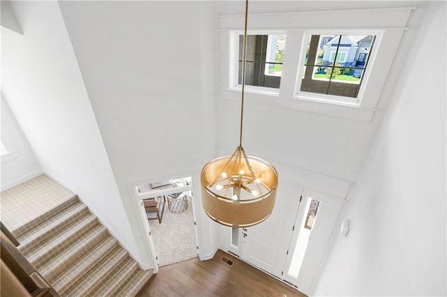 25212 W 92nd St, Lenexa, KS 66227 - details featuring visible vents, wood finished floors, and a notable chandelier