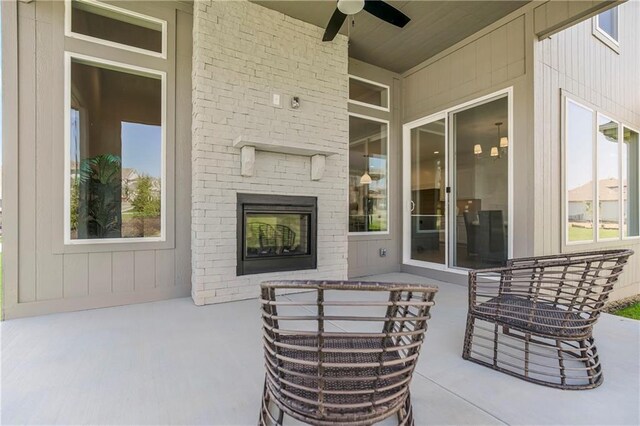 25212 W 92nd St, Lenexa, KS 66227 - view of patio / terrace featuring a fireplace and ceiling fan