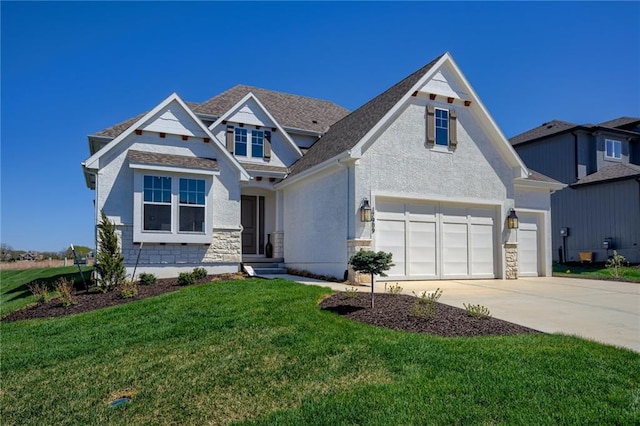 view of front facade with a front yard and a garage