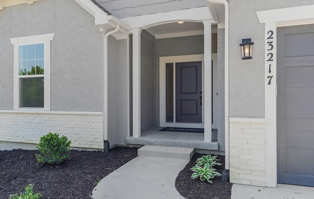 23217 W 124th Pl, Olathe, KS 66061 - doorway to property with stucco siding