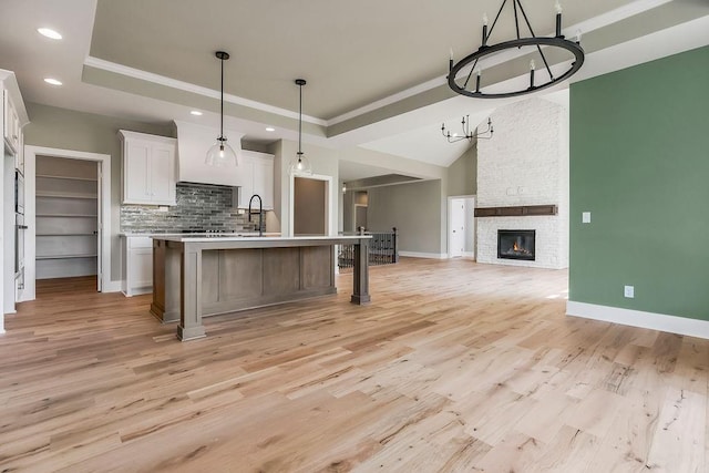 23217 W 124th Pl, Olathe, KS 66061 - kitchen featuring a chandelier, open floor plan, light countertops, recessed lighting, and white cabinetry