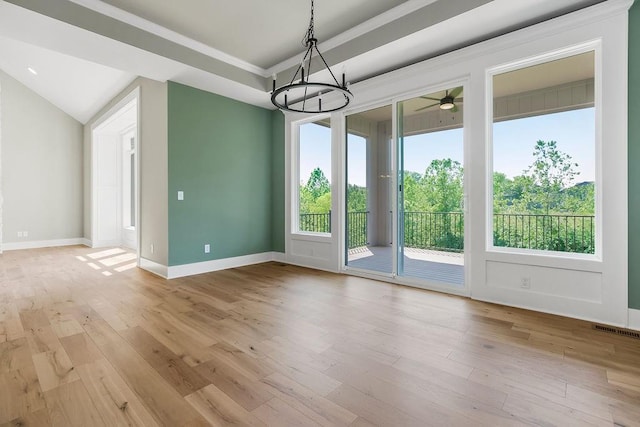 23217 W 124th Pl, Olathe, KS 66061 - unfurnished dining area featuring a chandelier, wood finished floors, ornamental molding, and a ceiling fan