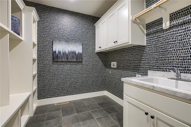 23217 W 124th Pl, Olathe, KS 66061 - washroom featuring a sink and dark tile patterned floors