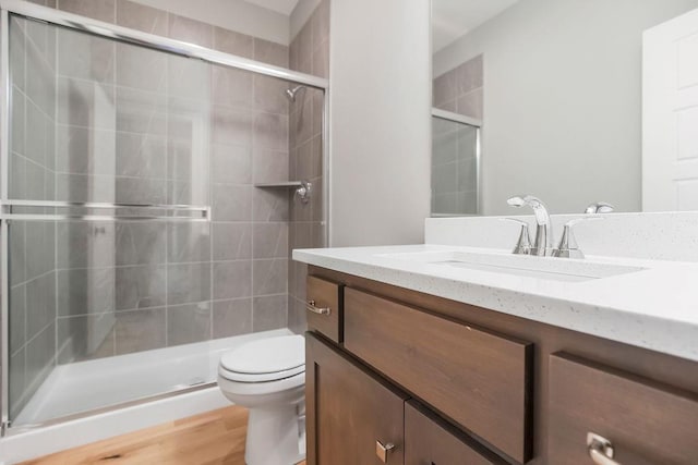 23217 W 124th Pl, Olathe, KS 66061 - full bathroom with vanity, a stall shower, and wood finished floors