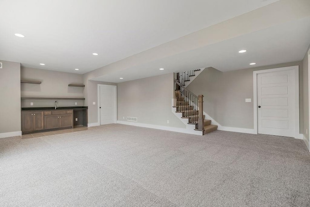 23217 W 124th Pl, Olathe, KS 66061 - unfurnished living room featuring recessed lighting, stairs, and light carpet
