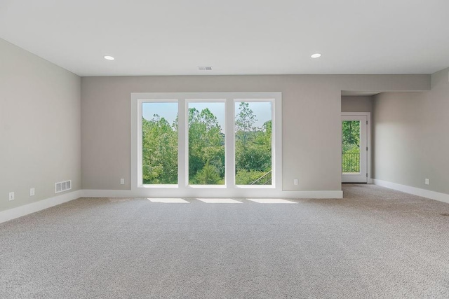 23217 W 124th Pl, Olathe, KS 66061 - unfurnished room featuring plenty of natural light, carpet floors, and recessed lighting