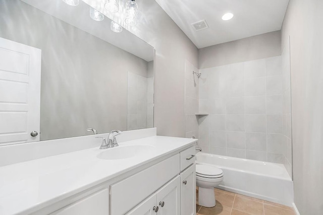 full bath with toilet, bathing tub / shower combination, tile patterned floors, visible vents, and vanity