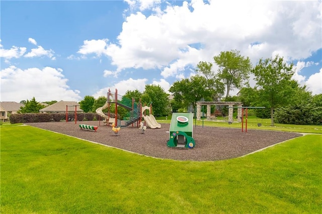 community jungle gym featuring a lawn