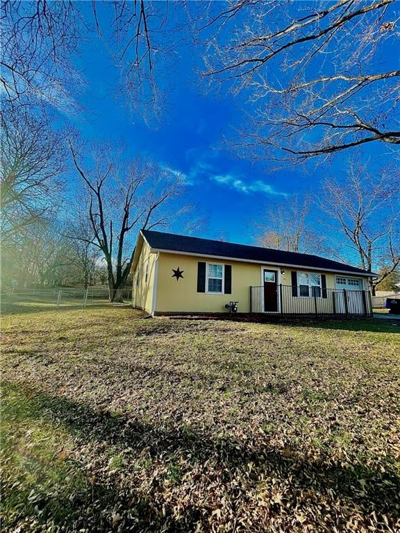 ranch-style home with a front lawn