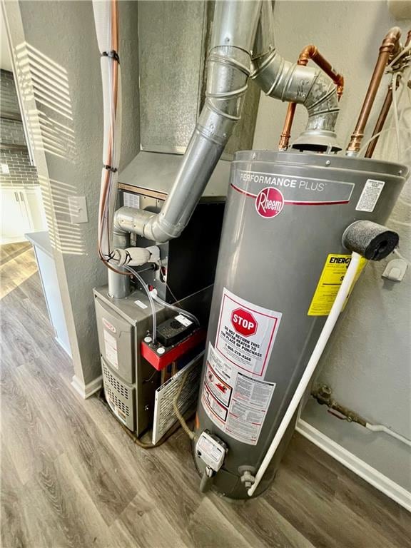 utility room featuring gas water heater