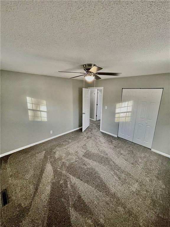 interior space featuring ceiling fan and a textured ceiling