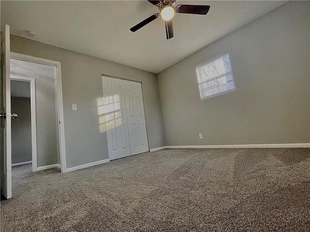 unfurnished bedroom featuring ceiling fan and carpet flooring