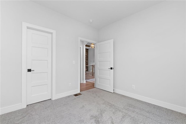 unfurnished bedroom with carpet