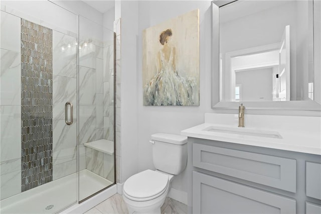 bathroom featuring vanity with extensive cabinet space, a shower with door, toilet, and tile floors