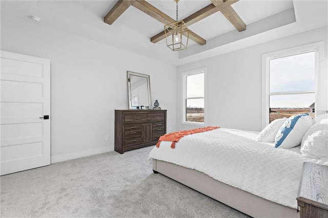 carpeted bedroom featuring beam ceiling, ceiling fan, and coffered ceiling