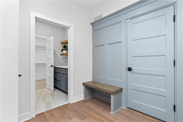 mudroom with light tile floors