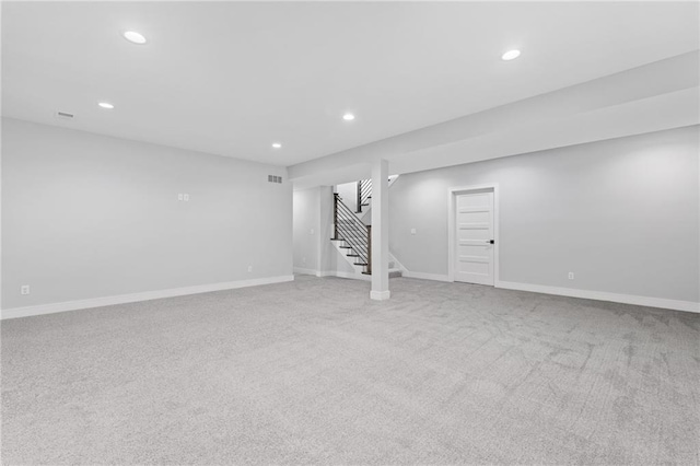 basement with light colored carpet