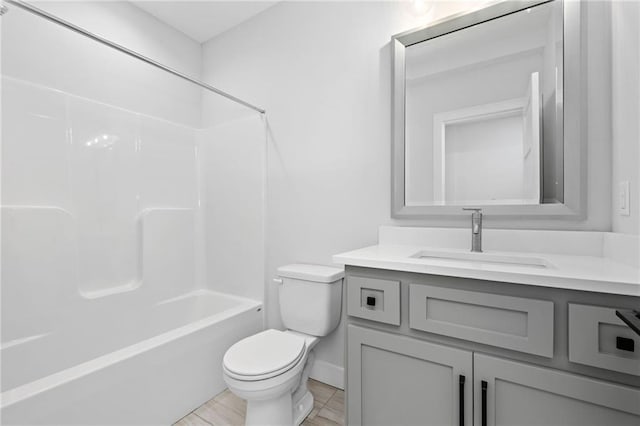 full bathroom featuring oversized vanity, tile floors, toilet, and shower / bathing tub combination