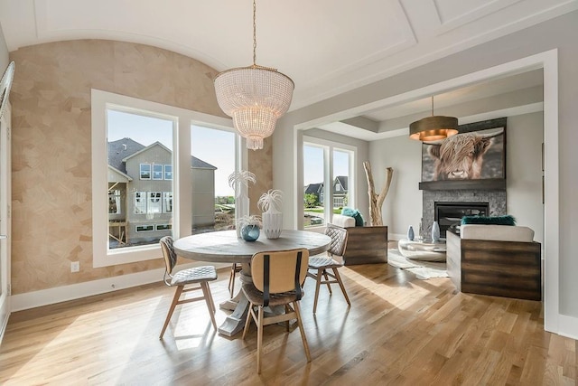 dining room with a chandelier and light wood-type flooring