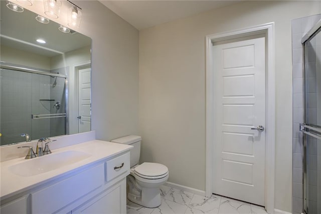 bathroom featuring walk in shower, oversized vanity, toilet, and tile floors