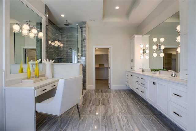 bathroom featuring tile floors, oversized vanity, a tray ceiling, and walk in shower