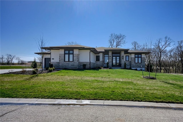 prairie-style home with a front lawn