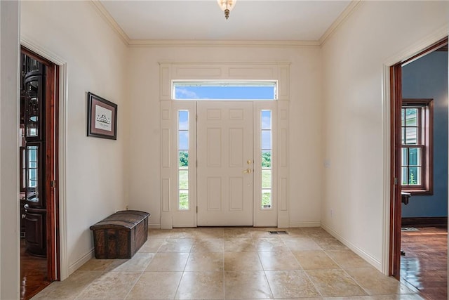 tiled foyer with crown molding