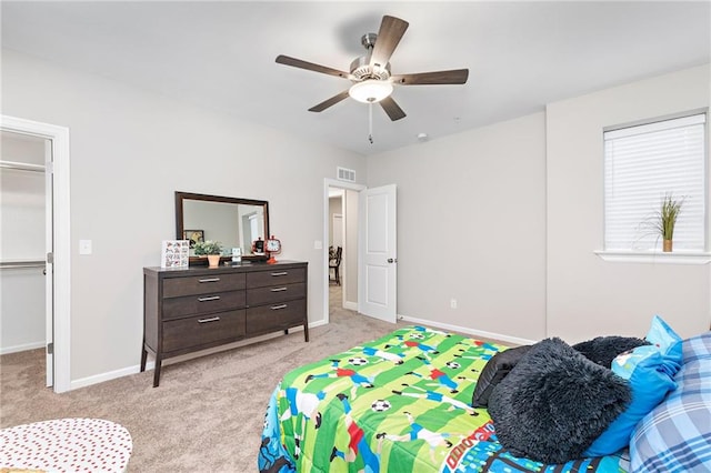 bedroom featuring light carpet and ceiling fan