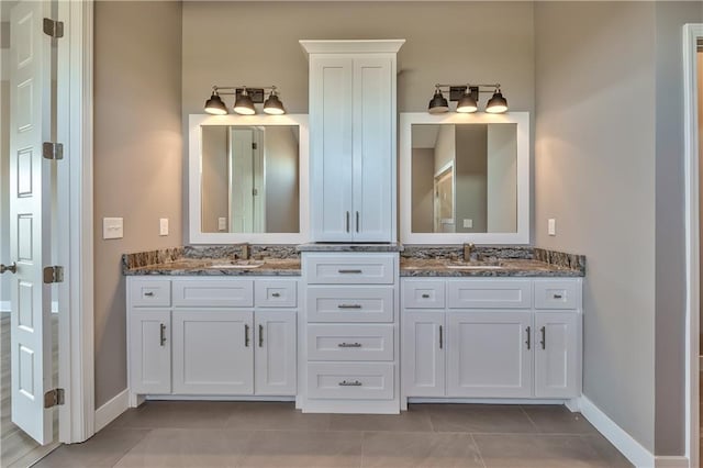 bathroom with tile patterned flooring and vanity