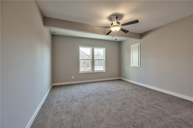 spare room featuring carpet floors and ceiling fan