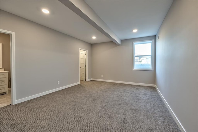 empty room featuring light colored carpet