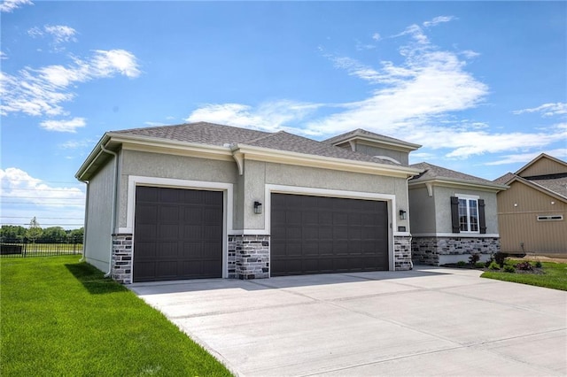 prairie-style house with a garage and a front yard