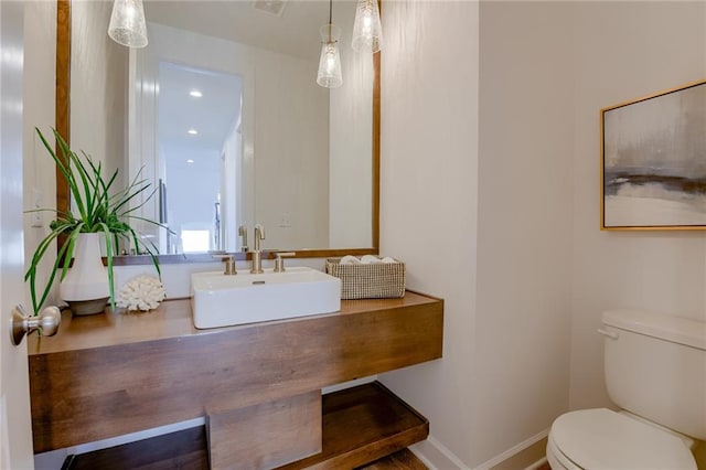 bathroom with toilet and sink