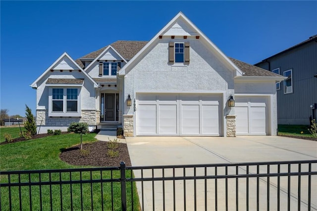 view of front facade with a garage and a front lawn